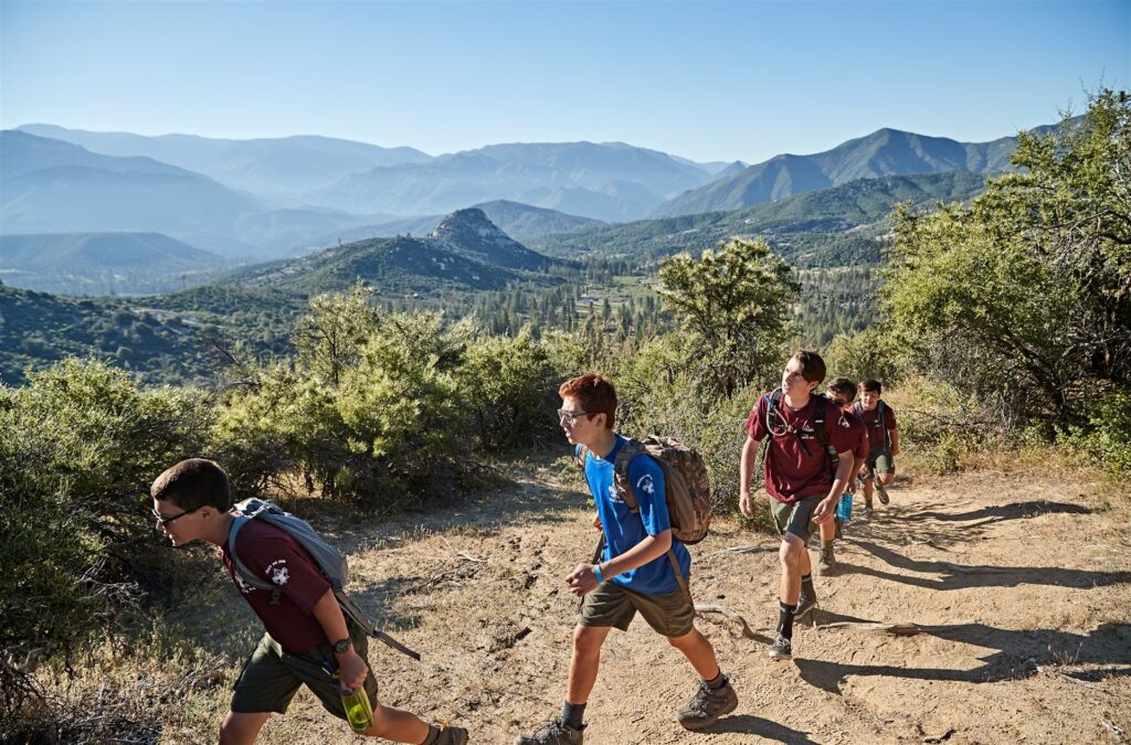 Scouts hiking together on a mountain overlook